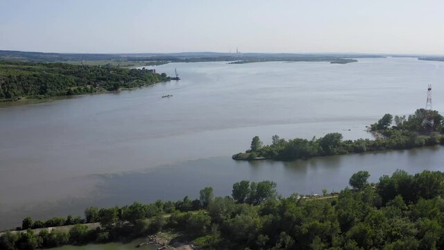 The confluence of the DTD canal with the Danube River. Drone aerial shot where the Danube is the widest