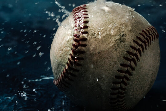 Action of water on old dirty baseball for rain game concept.