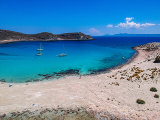 Obraz premium Aerial view of Simos beach in Elafonisos island in Greece. Elafonisos is a small Greek island the Peloponnese with idyllic exotic beaches and crystal clear waters. Laconia, Greece, Europe