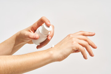 Woman applying hand care cream