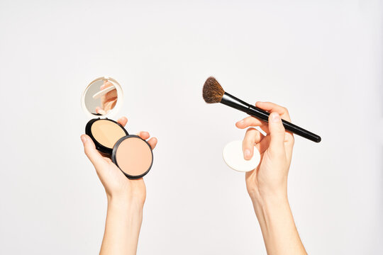 Woman with makeup powder and accessories
