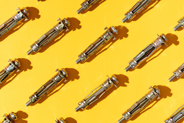 Background of identical metal anchors in rows