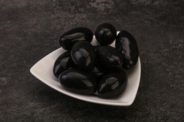Pickled black olives in the bowl