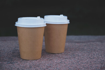 Two Cups of Coffee to Take away in Park on Marble Bench