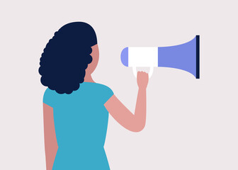 Young woman speaks into a megaphone