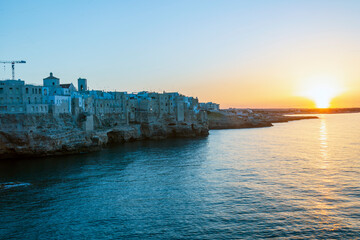 Fototapeta premium Sunset in Polignano a mare, in Bari in Puglia, a village by the sea
