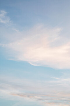 wispy pastel clouds at sunset