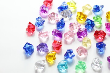 Colorful gems background, blue red green yellow white crystals 