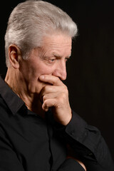 Close up portrait of thoughtful senior man