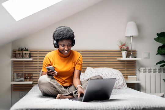 Happy Black Woman Using Laptop