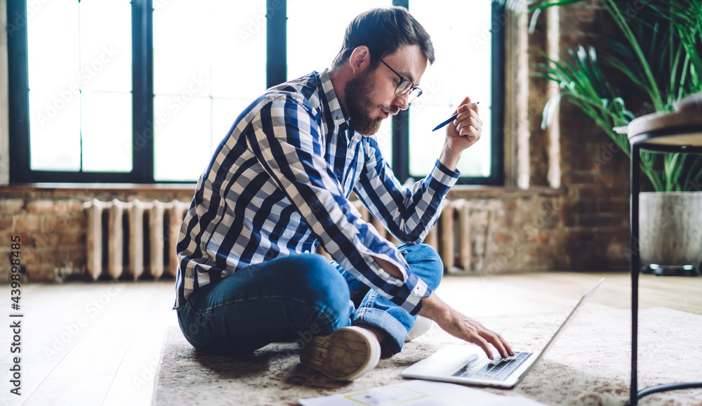 Poster caucasian male architect creating web design project during laptop working, skilled man in optical e