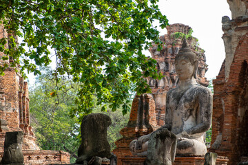 Fototapeta na wymiar Ancient pagoda and Buddha statue in Wat Mahathat , Ayutthaya