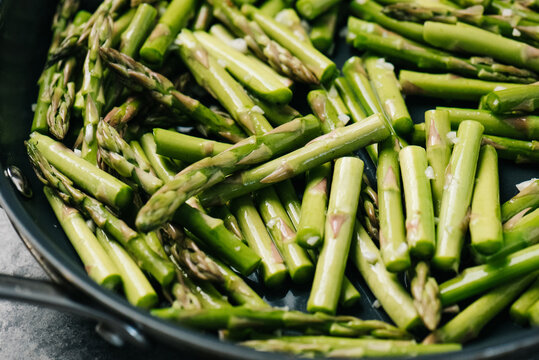 Sauteed Asparagus spears in a frying pan