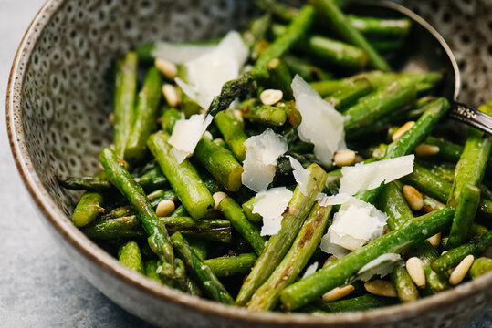 Sauteed asparagus with pine nuts and parmesan