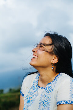 Portrait of a young and happy south asian woman