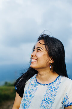 Portrait of a young and happy south asian woman