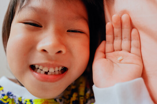 Little girl lost her first tooth