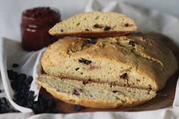 Slices of home baked Irish soda bread with raisins. A quick bread to make at home with out yeast. Served with fig jam.