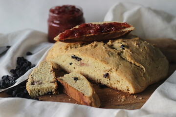Slices of home baked Irish soda bread with raisins. A quick bread to make at home with out yeast. Served with fig jam.