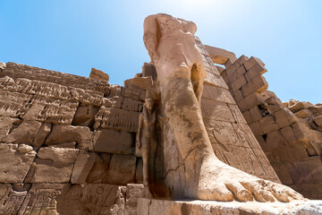 Feet of an ancient statue of Pharaoh in the Karnak temple in Luxor