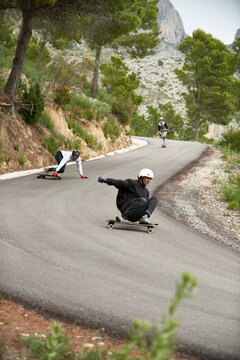 Downhill with longboard in the mountains.