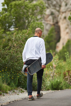 Downhill with longboard in the mountains.