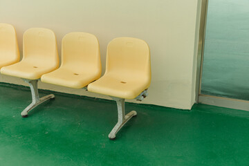 Green floor and yellow chair
