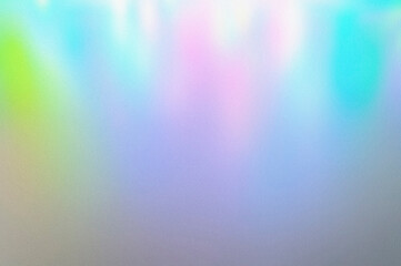 blur, grain, and texture of iridescent holographic abstract aurora light neon colors background. blurred pastel multicolored backdrop from glowing lights