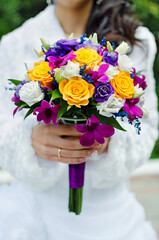 wedding bright bouquet in the hands of the bride close-up