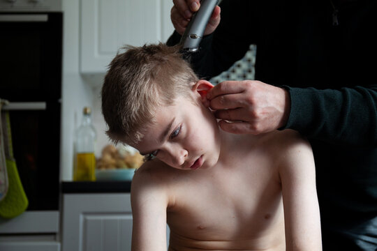Tween boy getting a home haircut