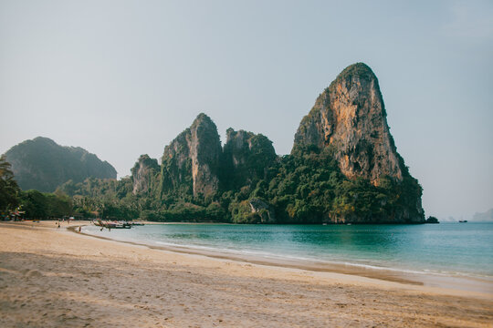 Sandy coast against rocky formations