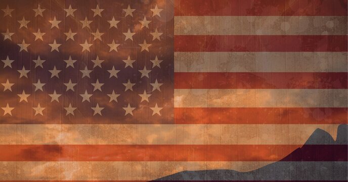 Composition of distressed vintage american flag over mountain silhouette