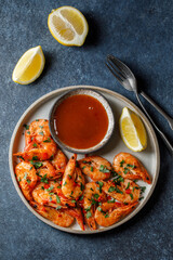 Ready-made shrimps with sauce on plate