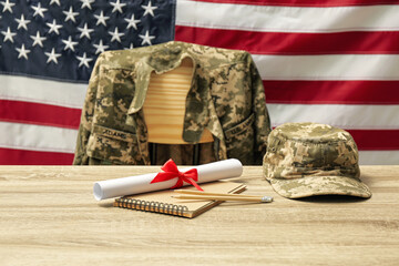 Diploma, stationery and soldier uniform near flag of United States. Military education
