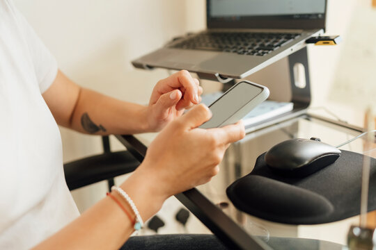 Anonymous Woman Using a Mobile Phone for Work