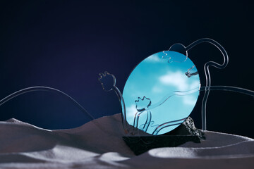 White clouds reflection in a round mirror and leave sprout