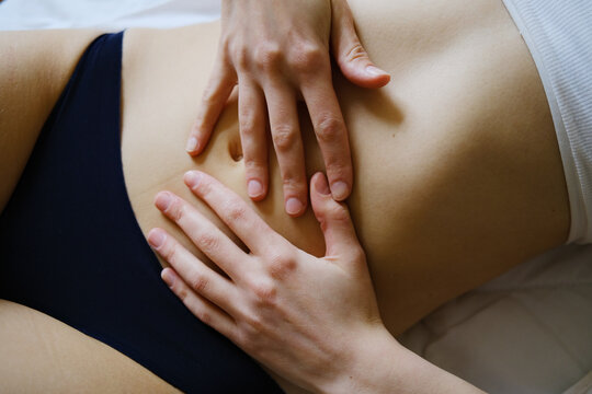 Girl touching her stomach