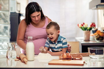 Family cooking together in kitchen