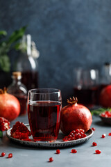Pomegranate juice on grey background