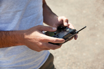 man holding drone remote control
