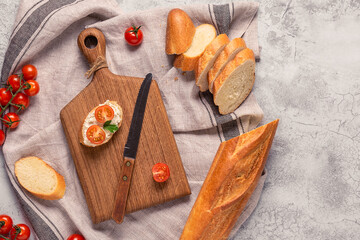 board, bread and tomatoes for making sandwiches