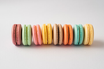 colorful macarons on white background