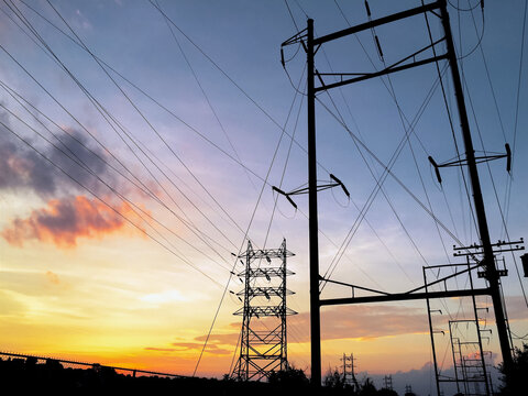 Power lines against a beautiful sunset