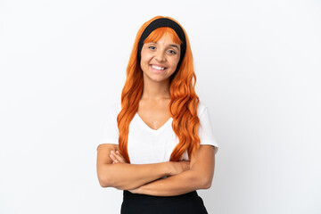 Young woman with orange hair isolated on white background keeping the arms crossed in frontal...