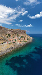 Aerial drone photo of beautiful castle and medieval old city of Monemvasia in the heart of Lakonia with beautiful clouds and deep blue sky, Peloponnese, Greece