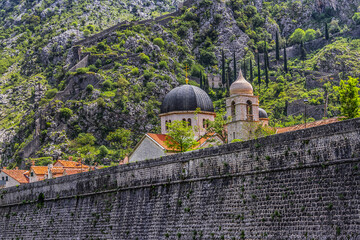Fortification walls in Kotor Old Town. The old Mediterranean port of Kotor is surrounded by...