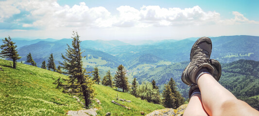 Wonderful view from Belchen hill mountain, meadow and forest trees - Landscape Southern Black Forest Aitern Germany background panorama - Hiking, young woman is sitting on a rock - obrazy, fototapety, plakaty