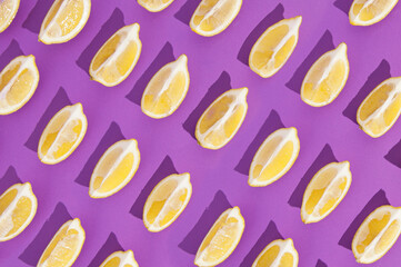 Pattern fresh lemon with  purple backgraung.Minimal sunlight flat lay