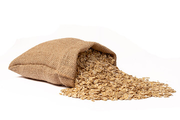 A full sack of oats lies on a white background. Close-up.