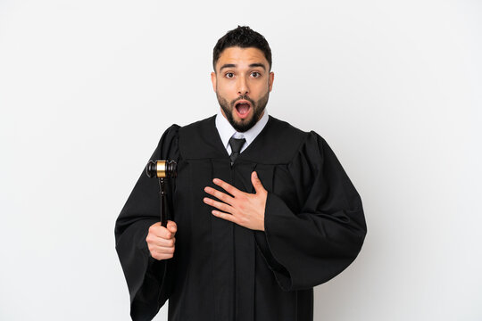 Judge arab man isolated on white background surprised and shocked while looking right